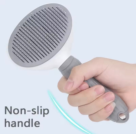 Spazzola autopulente 2-in-1 per cani e gatti.